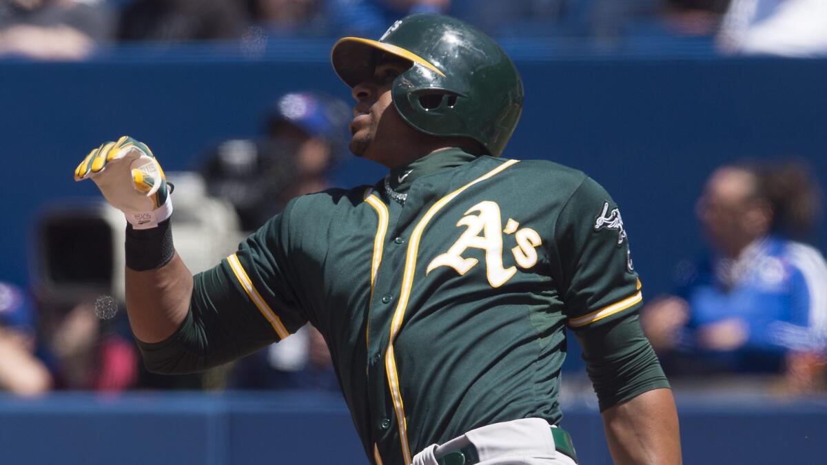 Oakland's Yoenis Cespedes hits a triple in the fourth inning of Saturday's 5-2 loss to the Toronto Blue Jays.