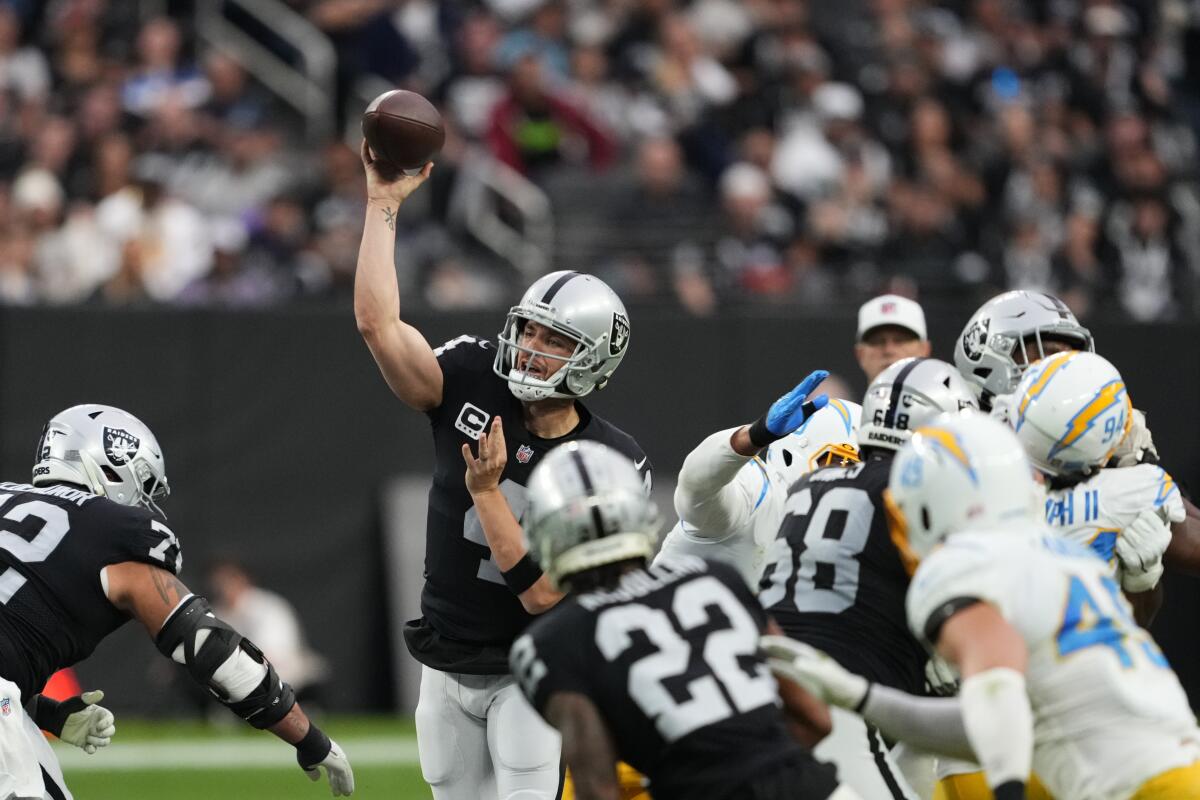 Raiders quarterback Derek Carr passes against the Chargers on Sunday.
