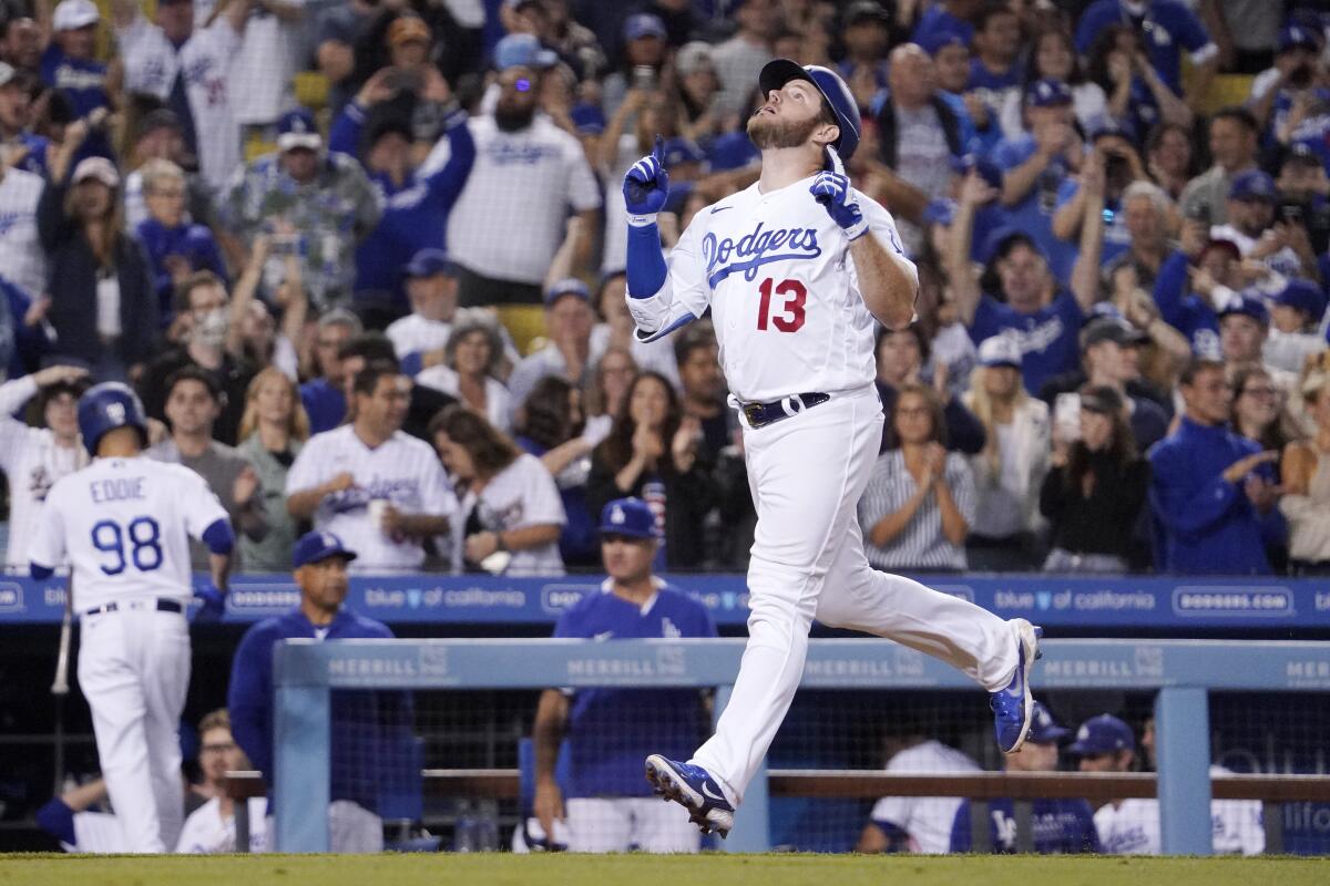 Dodgers first baseman Max Muncy celebrates after hitting a two-run home run against the Cubs in the eighth inning.