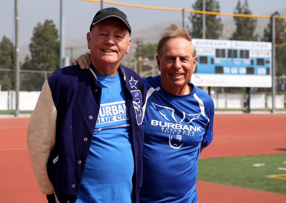 Former Burbank High School coaches Dave Kemp, left, and Frank Kallem, right, where honored with the distinction of having the school field named in their honor, Kemp Kallem Field, during celebration on campus in Burbank on Saturday, May 4, 2019.
