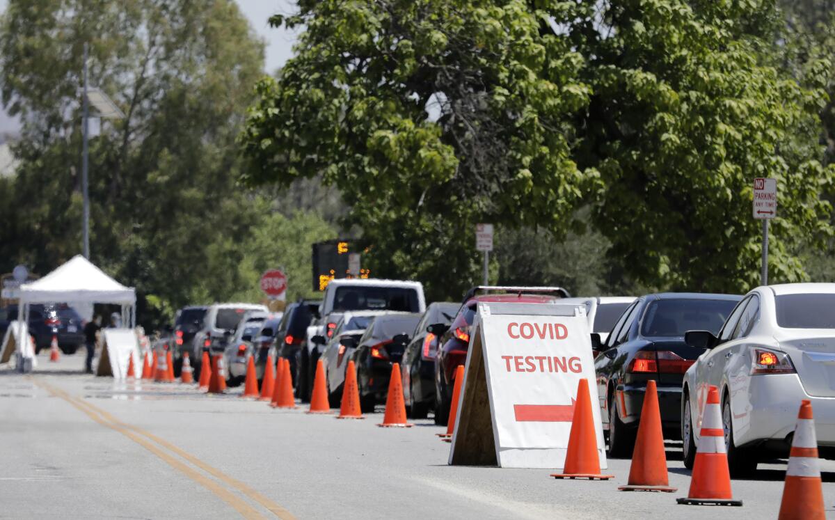 Cars line up to enter the COVID-19 testing site at Hansen Dam Recreation Center