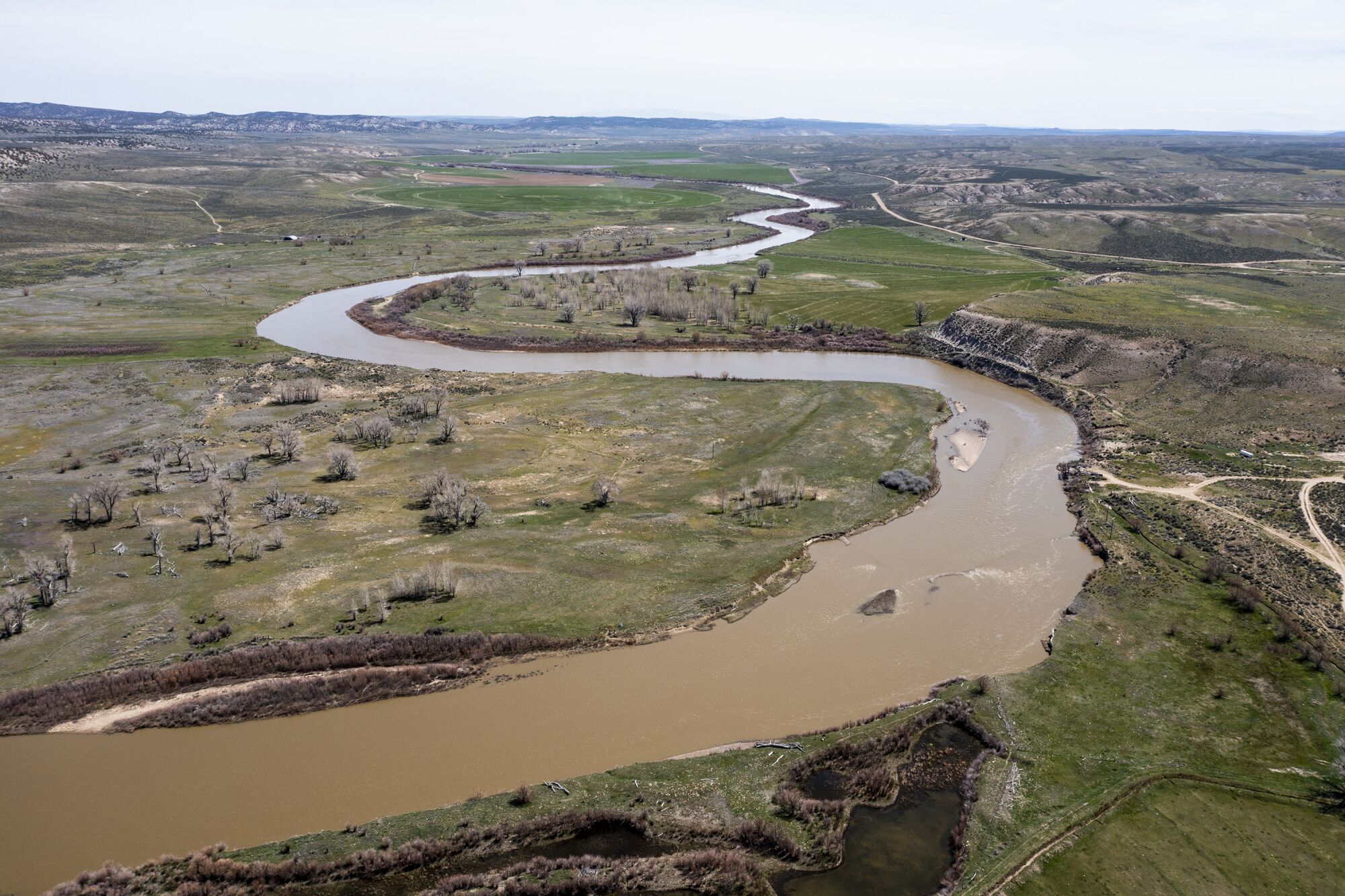 An aerial view of the Yampa River snaking through Cross Mountain Ranch. 