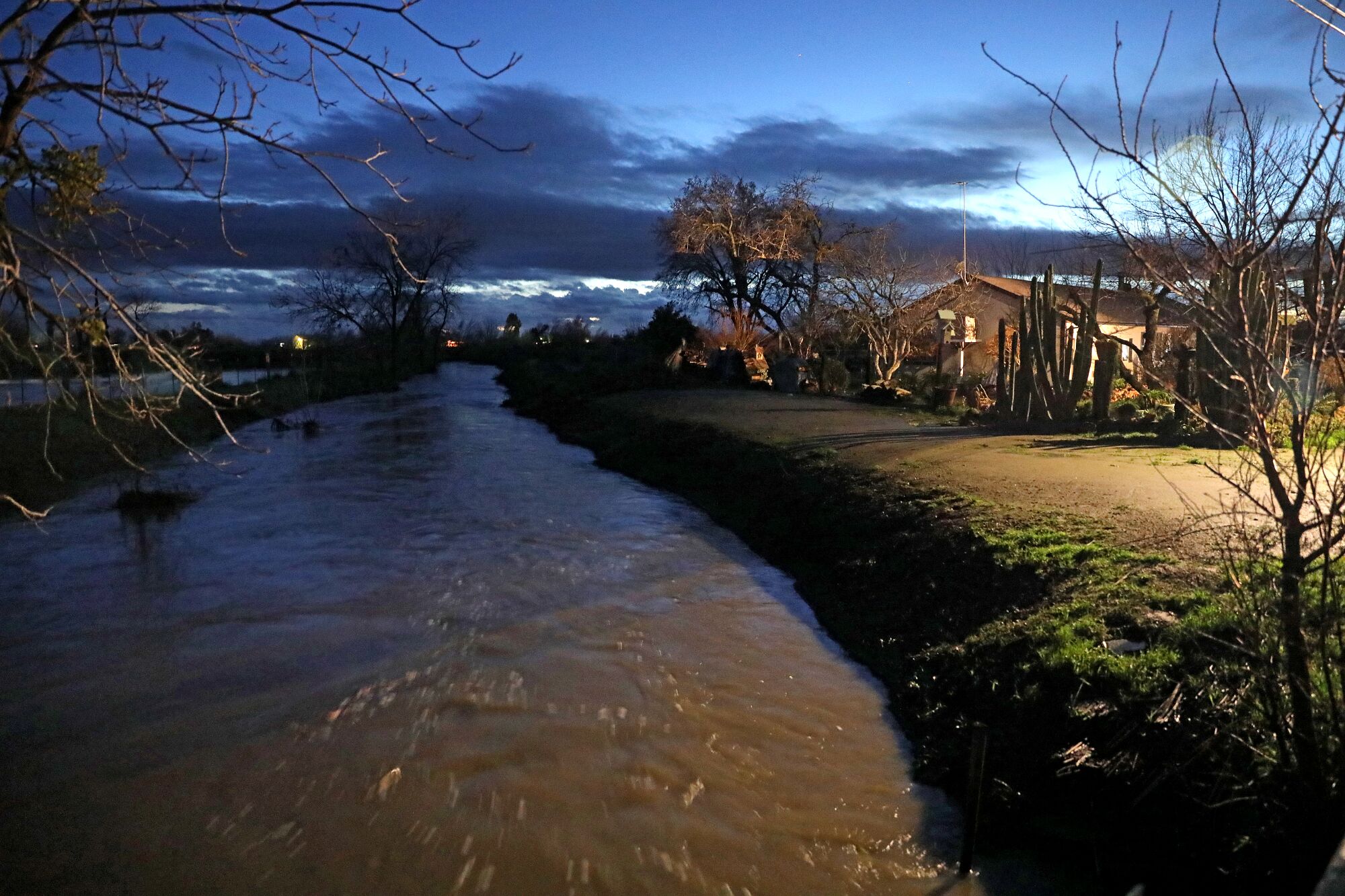 The home sits next to Miles Creek at the corner of Hupp Street and East Childs Avenue in Planada.