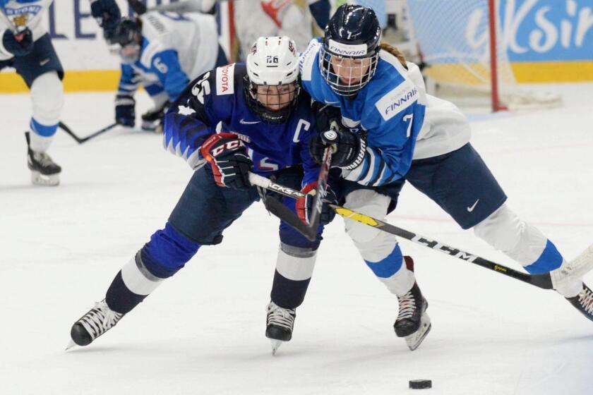 TOPSHOT - Kendall Coyne Schofield (L) of the United States and Nelli Laitinen of Finland vie during the IIHF Women's Ice Hockey World Championships final match between the United States and Finland in Espoo, Finland, on April 14, 2019. (Photo by Mikko Stig / Lehtikuva / AFP) / Finland OUTMIKKO STIG/AFP/Getty Images ** OUTS - ELSENT, FPG, CM - OUTS * NM, PH, VA if sourced by CT, LA or MoD **