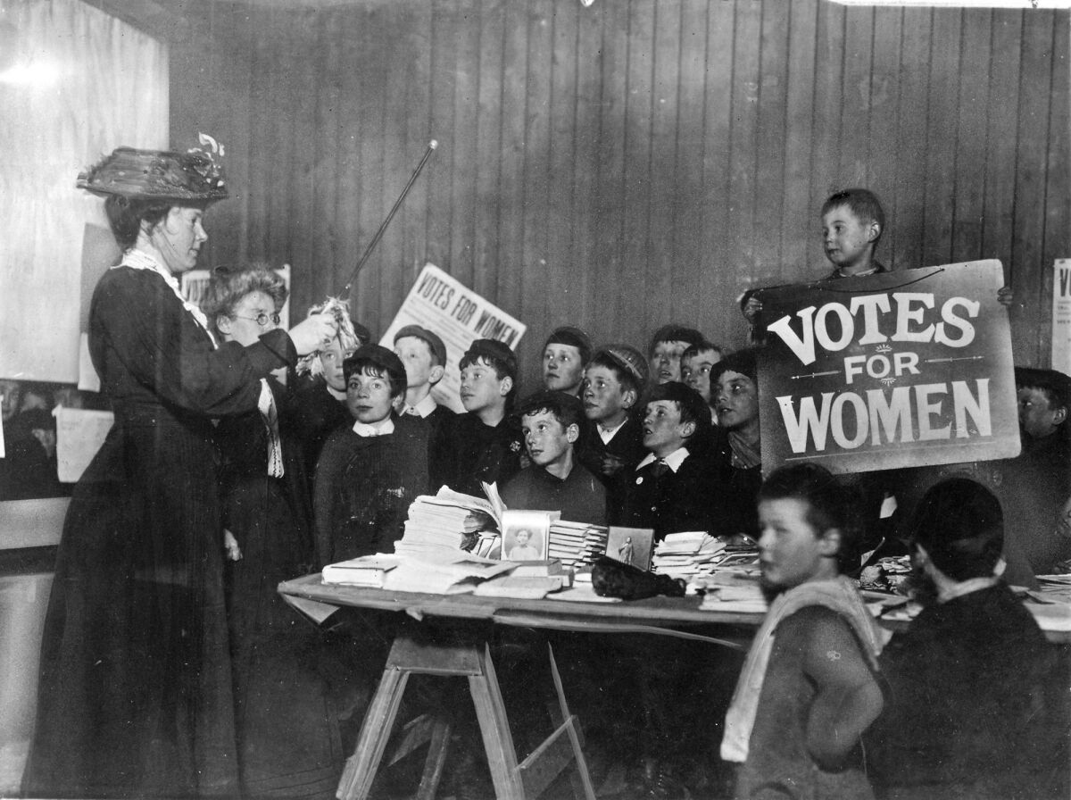 School children learn the suffragist "war song."