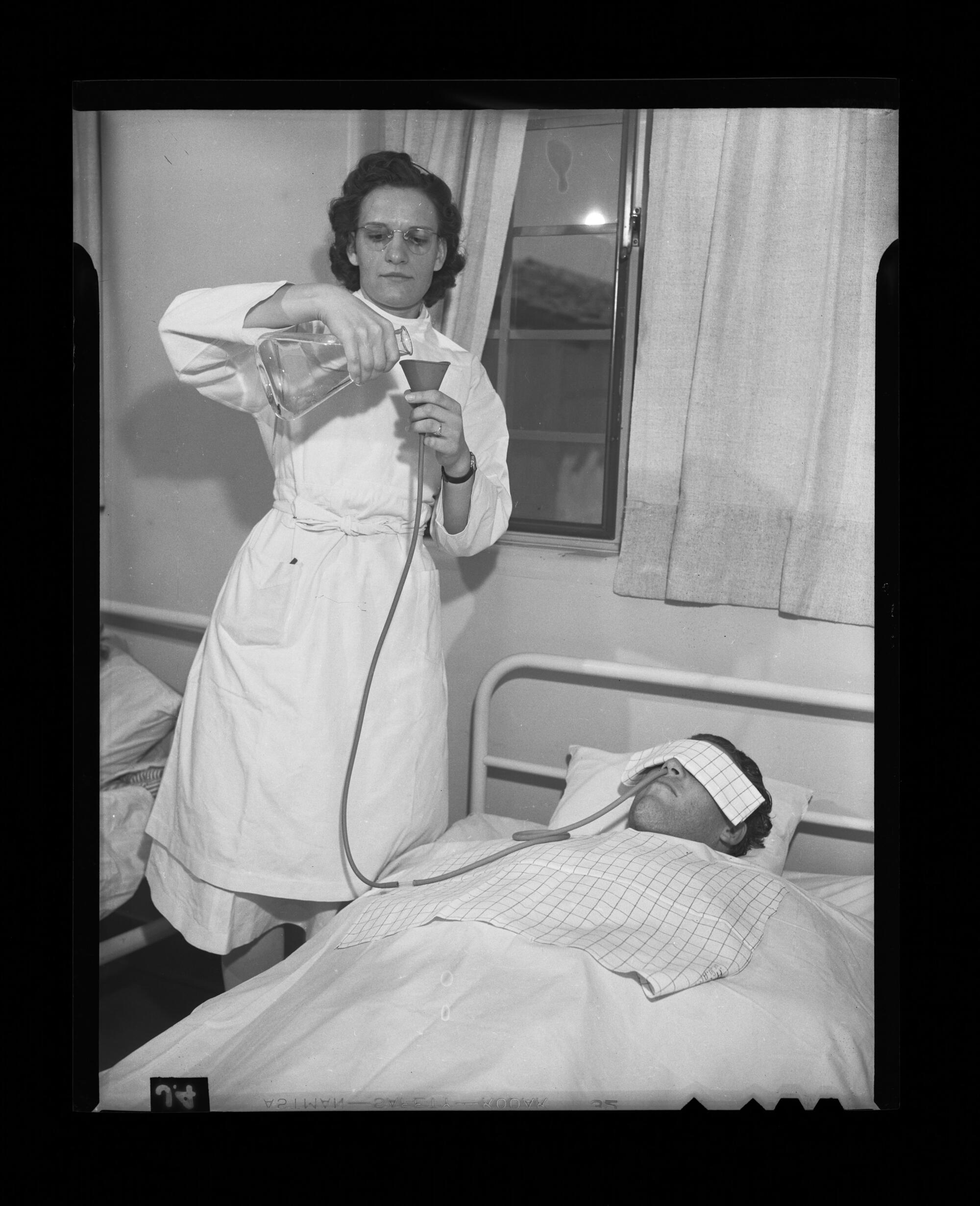 A nurse administers sedatives to a patient to treat insanity at Camarillo State Hospital in 1940.