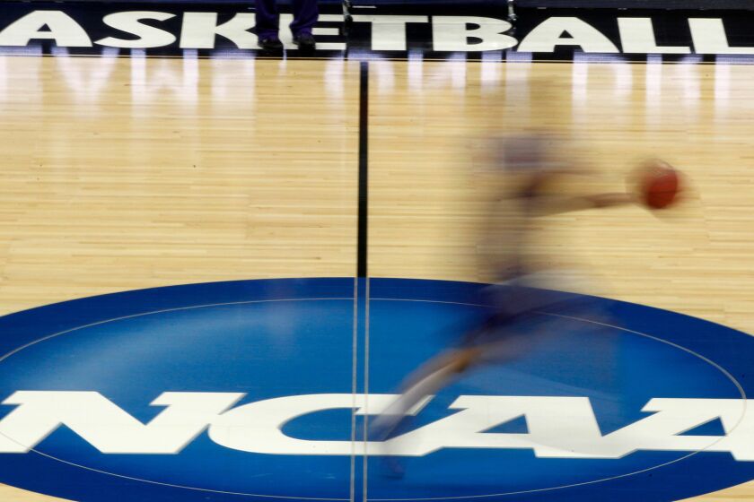 FILE - In this March 14, 2012, file photo, a player runs across the NCAA logo during practice in Pittsburgh before an NCAA tournament college basketball game. College basketball spent an entire season operating amid a federal corruption investigation that magnified long-simmering problems within the sport, from unethical agent conduct to concerns over the "one-and-done" model. Now itâs time to hear new ideas on how to fix them. On Wednesday morning, April 25, 2018, the commission headed by former Secretary of State Condoleezza Rice will present its proposed reforms to university presidents of the NCAA Board of Governors and the Division I Board of Directors at the NCAA headquarters in Indianapolis. And that starts what could be a complicated process in getting changes adopted and implemented in time for next season. (AP Photo/Keith Srakocic, File)