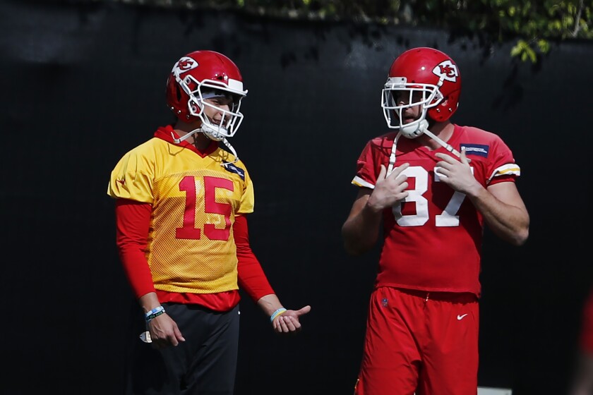 Chiefs quarterback Patrick Mahomes and tight end Travis Kelce talk during practice on Jan. 30, 2020, in Davie, Fla.