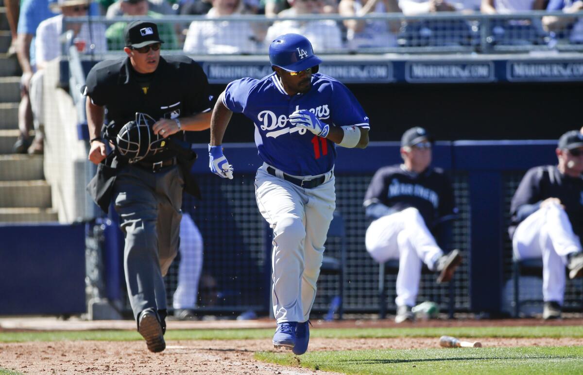 Dodgers shortstop Jimmy Rollins hustles down the line in a spring training game earlier this month.