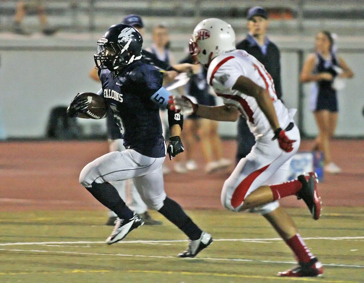 Crescenta Valley runningback William Wang out runs Pasadena's Andres Arias for a first quarter touchdown in a Pacific League football game at Glendale High School on Friday, September 28, 2012.