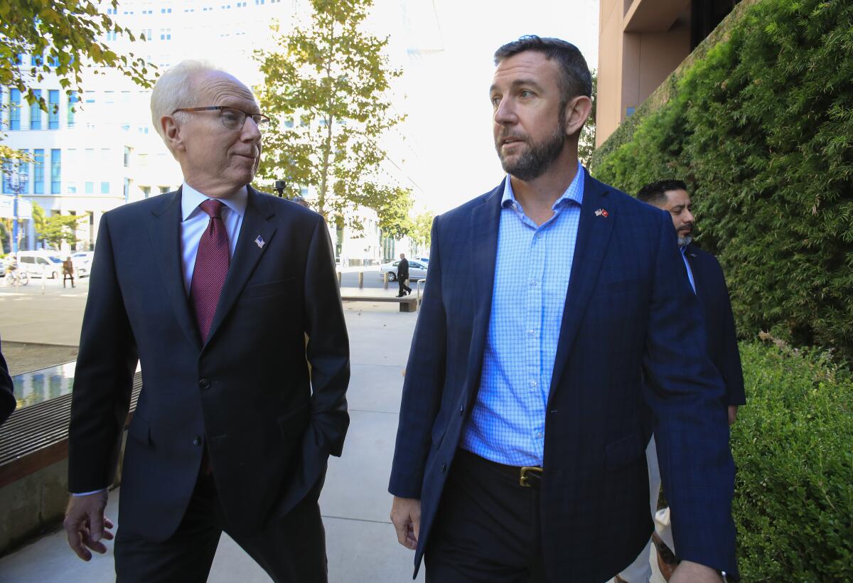 Congressman Duncan Hunter arrives to U.S. District Court Monday, Nov. 25, 2019 with his attorney Paul Pfingst.