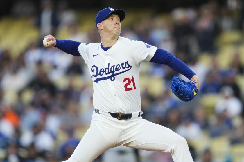 Los Angeles Dodgers starting pitcher Walker Buehler throws during the first inning.