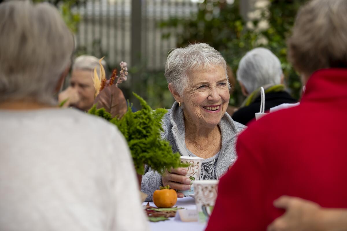 Julie Jenkins, a volunteer at Sherman Gardens since 1975, attends a "First Monday Coffee" meeting. 
