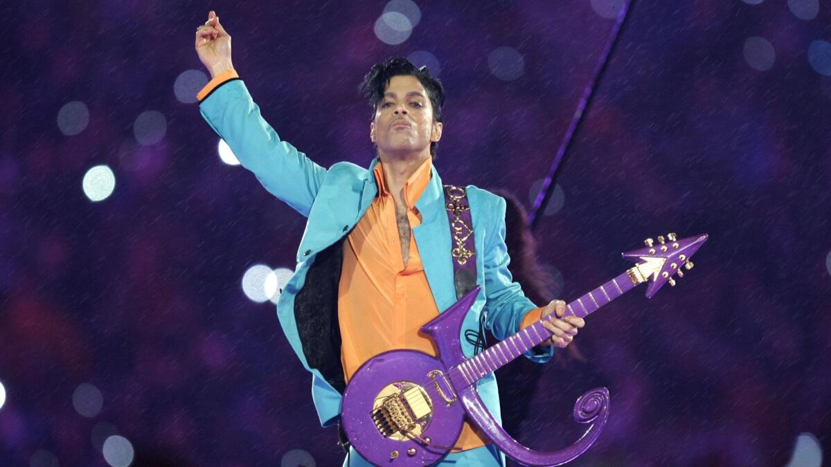 Prince performs during the halftime show at the Super Bowl XLI football game in 2007 at Dolphin Stadium in Miami.