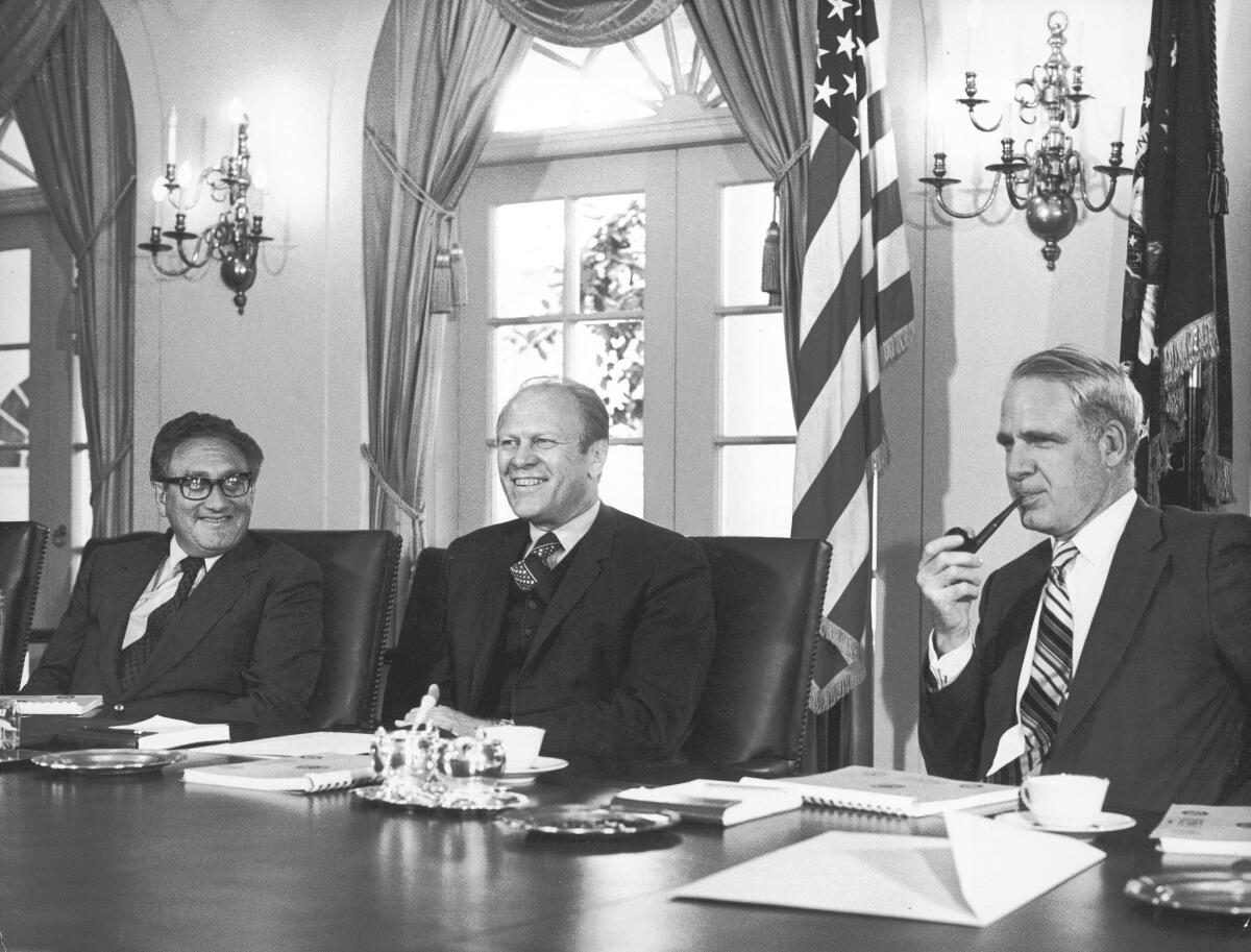 At a 1974 Cabinet meeting at the White House, Secretary of Defense James Schlesinger, right, sits with President Gerald Ford and Secretary of State Henry Kissinger. Though they often disagreed, Kissinger called Schlesinger his intellectual "equal."
