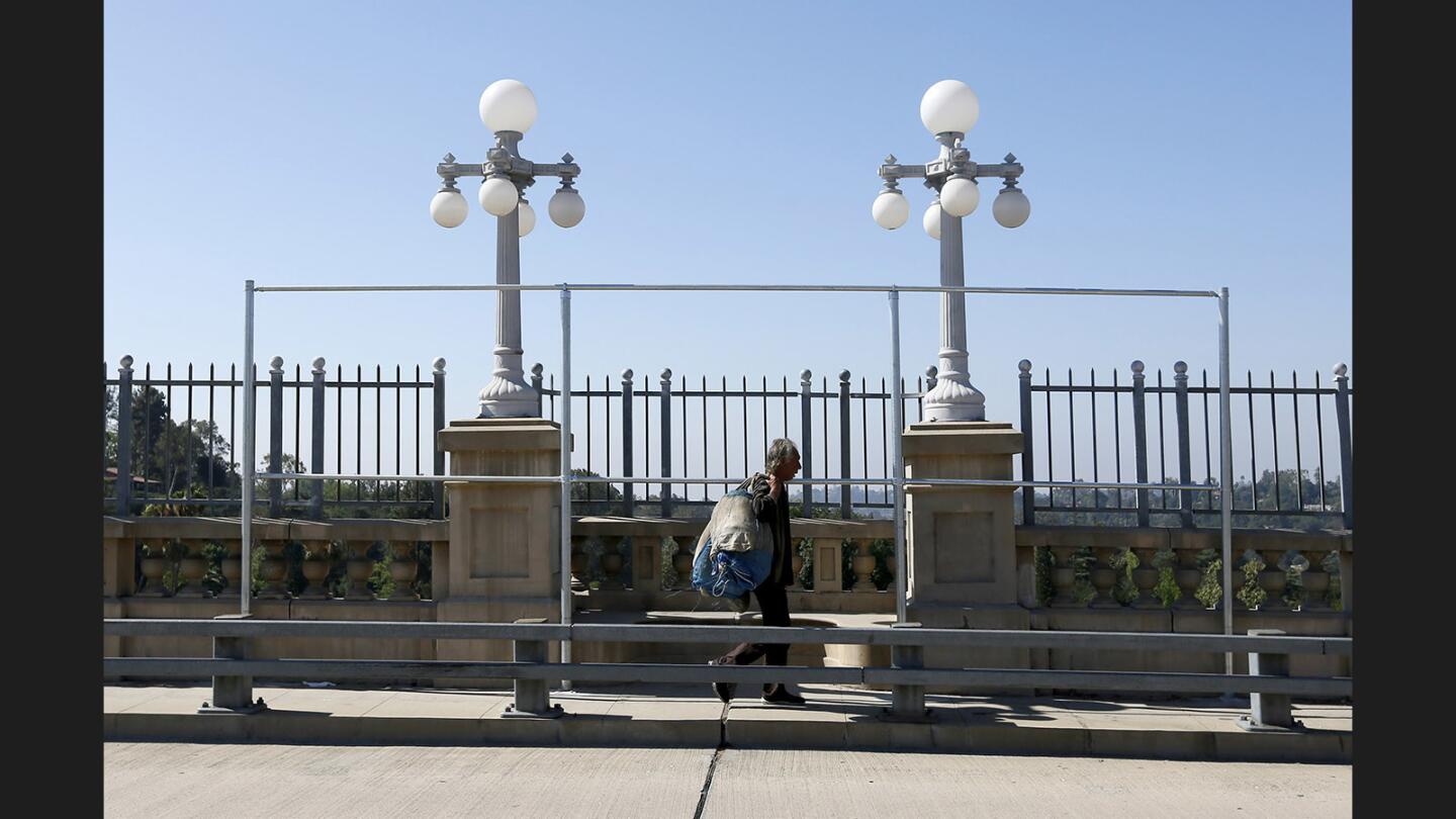 Photo Gallery: Colorado Street Bridge in Pasadena gets protective mesh fencing around 20 alcoves to prevent easy access to jump