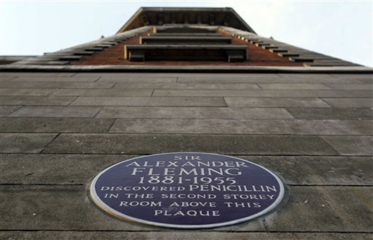 This Monday, Dec. 5, 2011 photo shows a plaque for Sir Alexander Fleming on a wall at the St. Mary's Hospital in Paddington, London. In January 2011, the government introduced a new health bill many fear will bring even more draconian cuts and competition from private providers. The bill is now in the process of being adopted and will overhaul the current management structure and axe more than 20,000 health jobs in the next two years. An undisclosed number of hospitals will also be shut, rumored to include St. Mary's in London, where Alexander Fleming discovered penicillin. (AP Photo/Kirsty Wigglesworth)