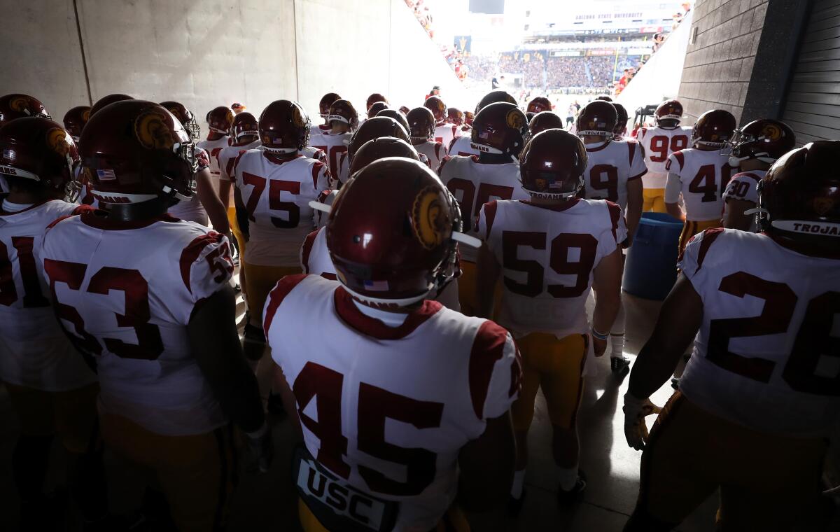 USC football players take the field before a game against Arizona State on Nov. 9.