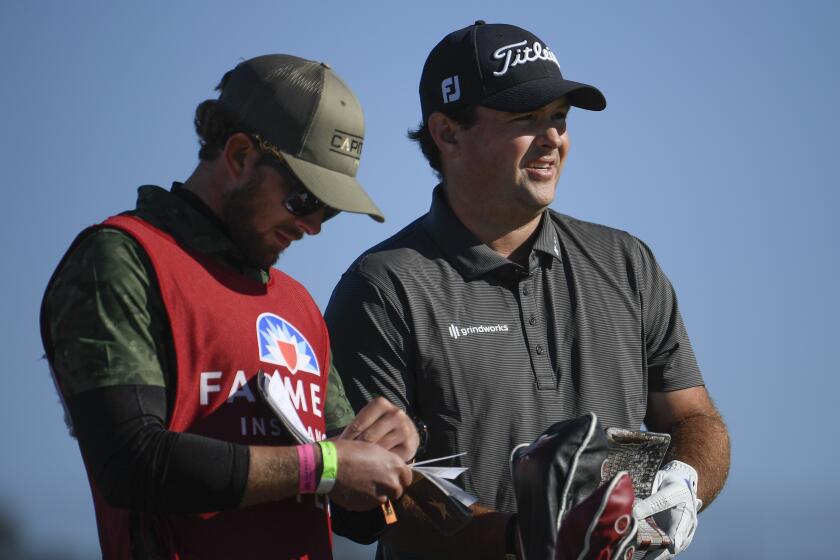 Patrick Reed and his caddie wait on the second hole on the south course at Torrey Pines during the third round of the 2021 Farmers Insurance Open Saturday, Jan. 30, 2021, in San Diego. (Photo by Denis Poroy)