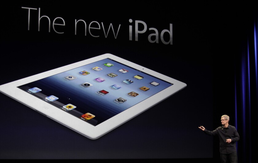 Apple Chief Executive Tim Cook unveils the iPad 3 at the Yerba Buena Center for the Arts in San Francisco on Wednesday.