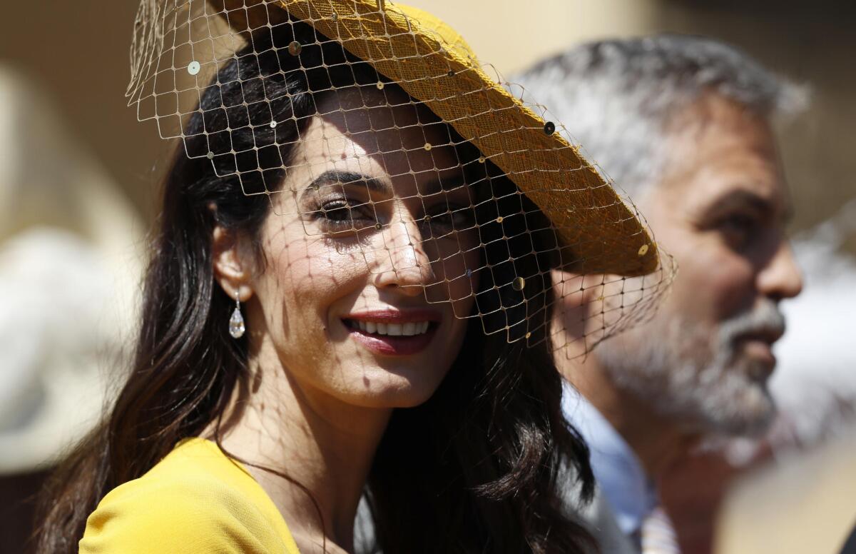 Amal Clooney and George Clooney arrive for the wedding of Prince Harry and Meghan Markle.