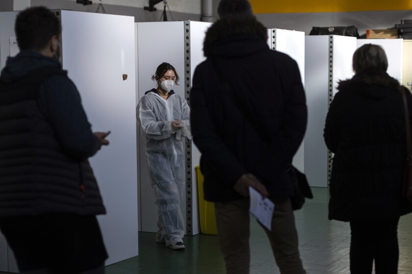 FILE - A medical worker prepares to perform nasal tests, at a COVID-19 testing site, in Nantes, western France, Friday, Dec. 31, 2021. An unprecedented number of coronavirus infections is once again exposing the underfunding and shortcomings of public health care systems, even in developed parts of Europe. (AP Photo/Jeremias Gonzalez, File)