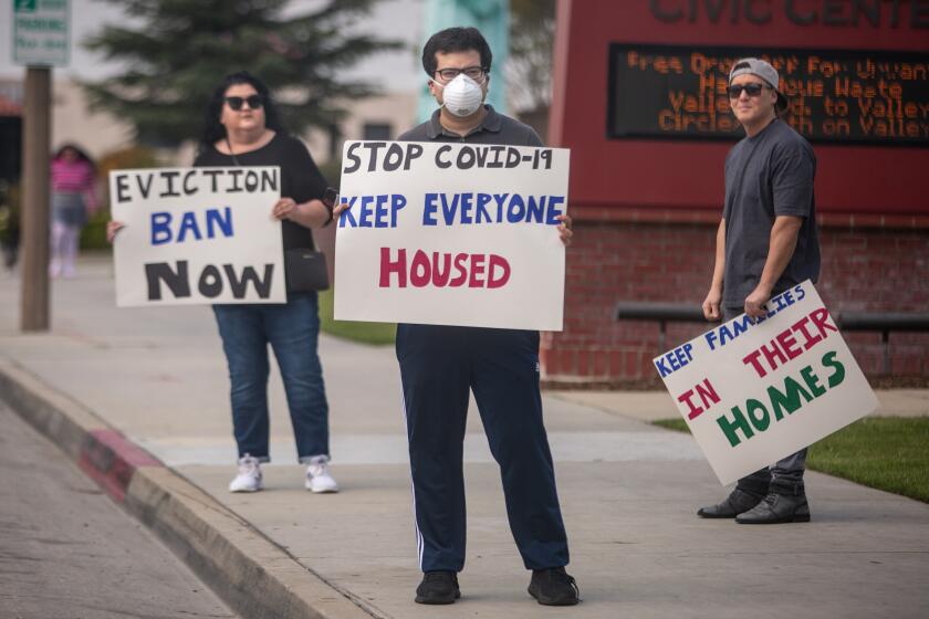 EL MONTE, CA - MARCH 29: Tenant rights activists assemble at the El Monte City Hall to demand that the El Monte City Council pass an eviction moratorium barring all evictions during the coronavirus pandemic on Sunday, March 29, 2020 in El Monte, CA. (Jason Armond / Los Angeles Times)