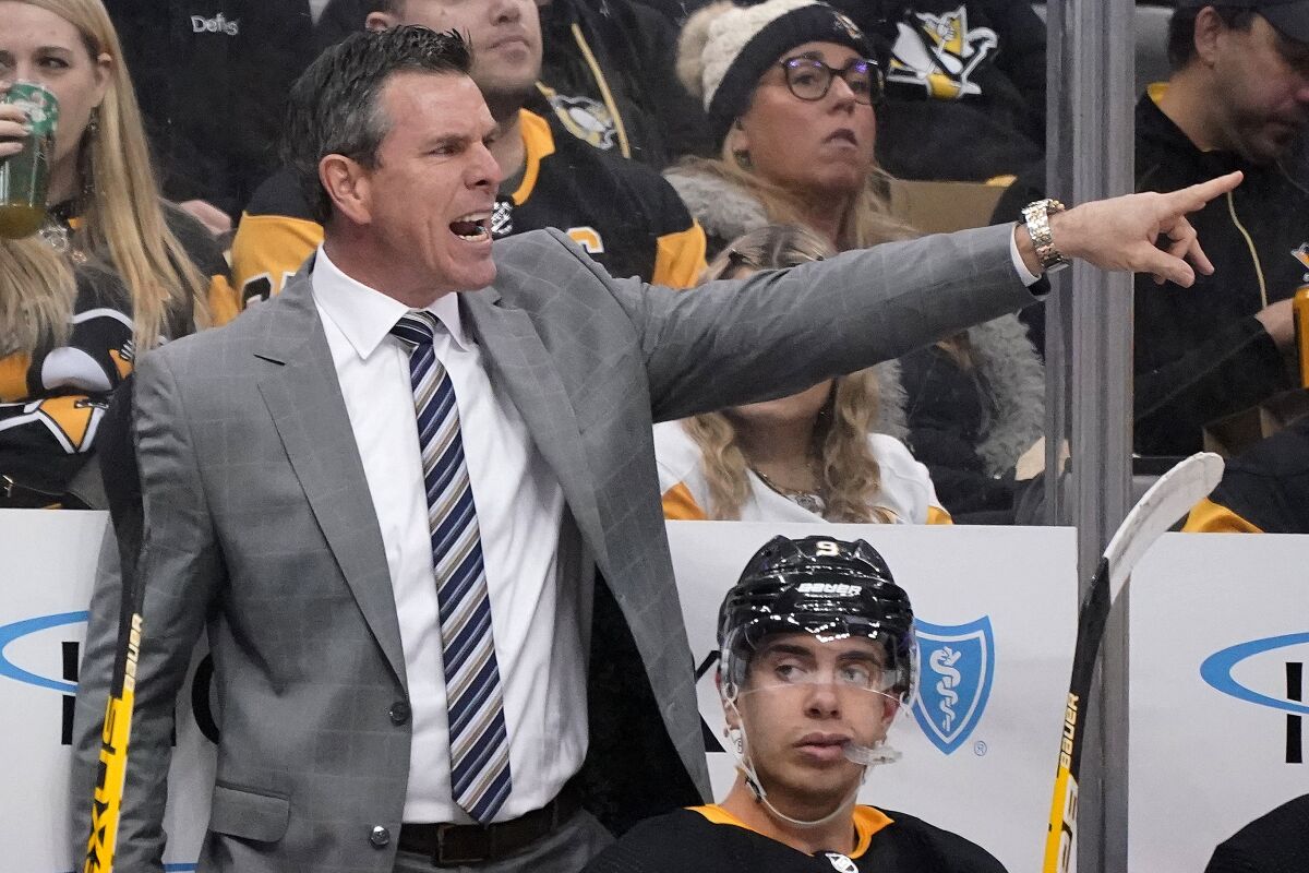 Pittsburgh Penguins coach Mike Sullivan directs a power play during the second period of the team's NHL hockey game against the Florida Panthers in Pittsburgh, Tuesday, March 8, 2022. The Panthers won 4-3. (AP Photo/Gene J. Puskar)