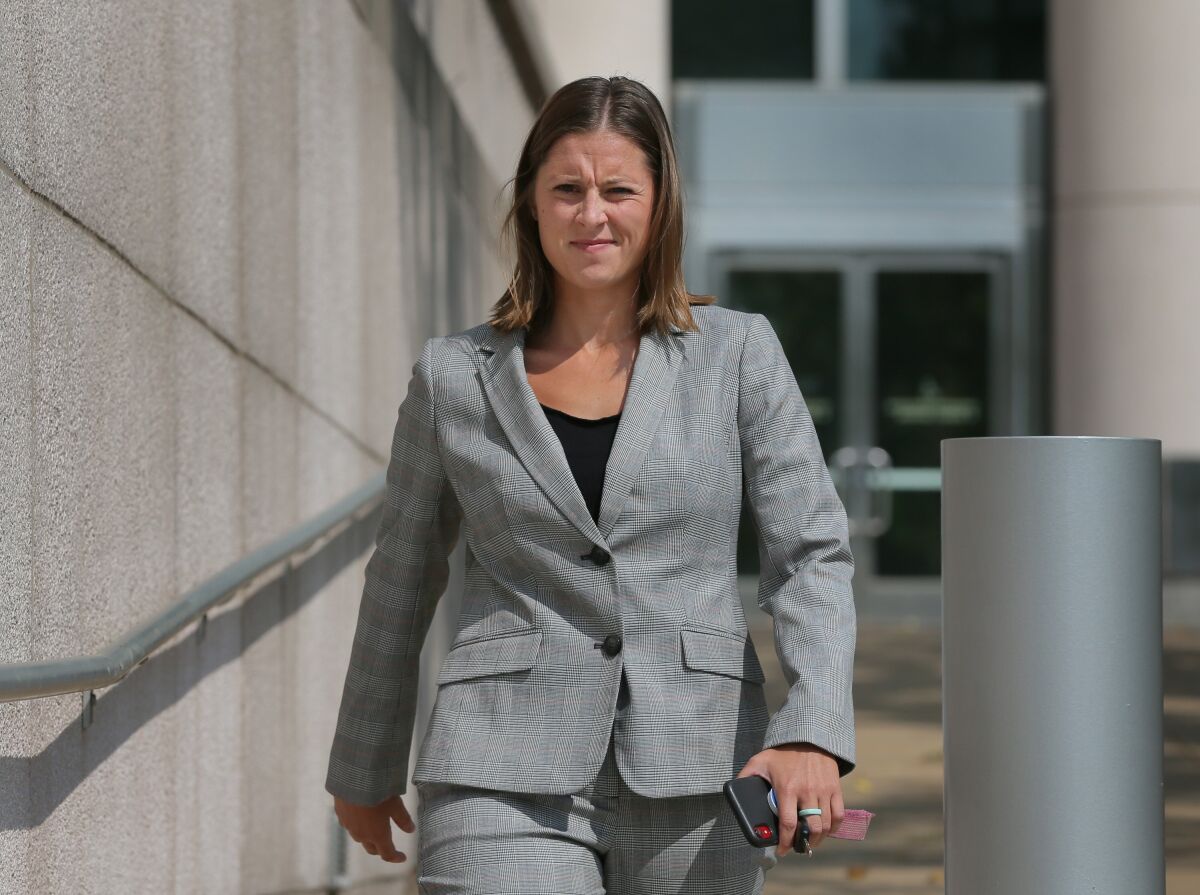 This Sept. 6, 2019 photo shows former St. Louis Police officer Bailey Colletta walking out of Federal Court in St. Louis. Colletta has been sentenced to three years of probation for her role in the beating of a Black, undercover police officer during a 2017 protest. Colletta was sentenced Thursday, July 15, 2021, in federal court after pleading guilty nearly two years ago to making a false declaration to a grand jury, admitting she lied to the FBI and a federal grand jury in an effort to cover up the attack on Officer Luther Hall. (David Carson/St. Louis Post-Dispatch via AP)
