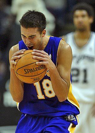 Los Angeles Lakers' Sasha Vujacic reacts after he was called for fouling San Antonio Spurs' Tim Duncan.