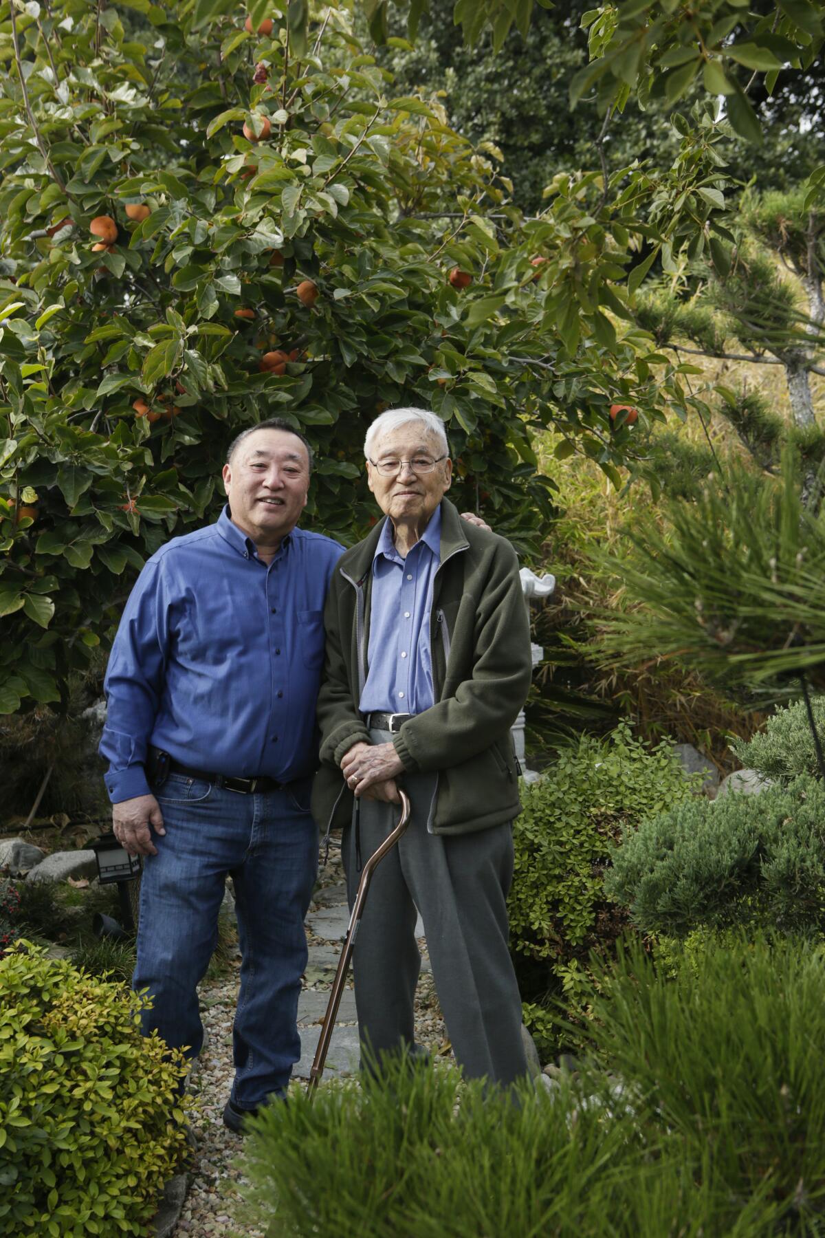John Nishio, 71, left, and Shig Nishio, 98
