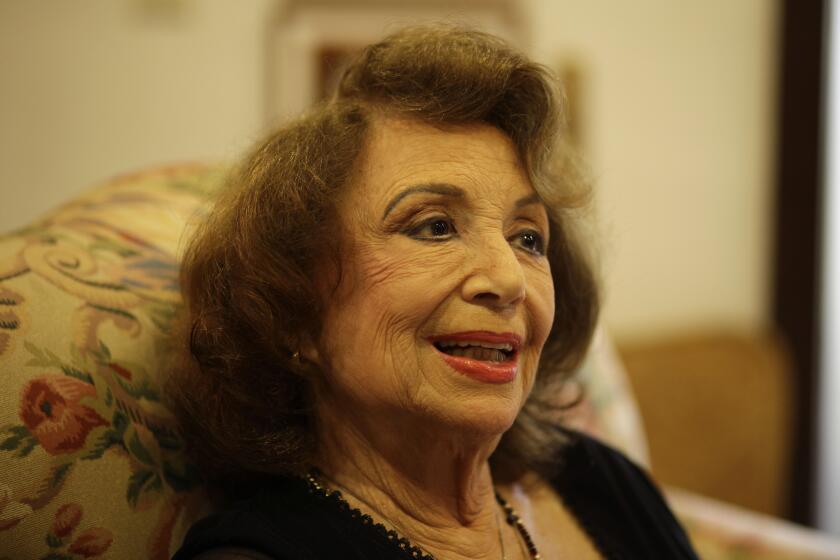 FILE - In this Oct. 24, 2011 file photo, writer Delia Fiallo speaks during an interview in her home in Coral Gables, Fla. Fiallo, who wrote many successful telenovelas, such as "Cristal" and "Kasandra," has died on Tuesday, June 29, 2021. (AP Photo/Lynne Sladky, File)