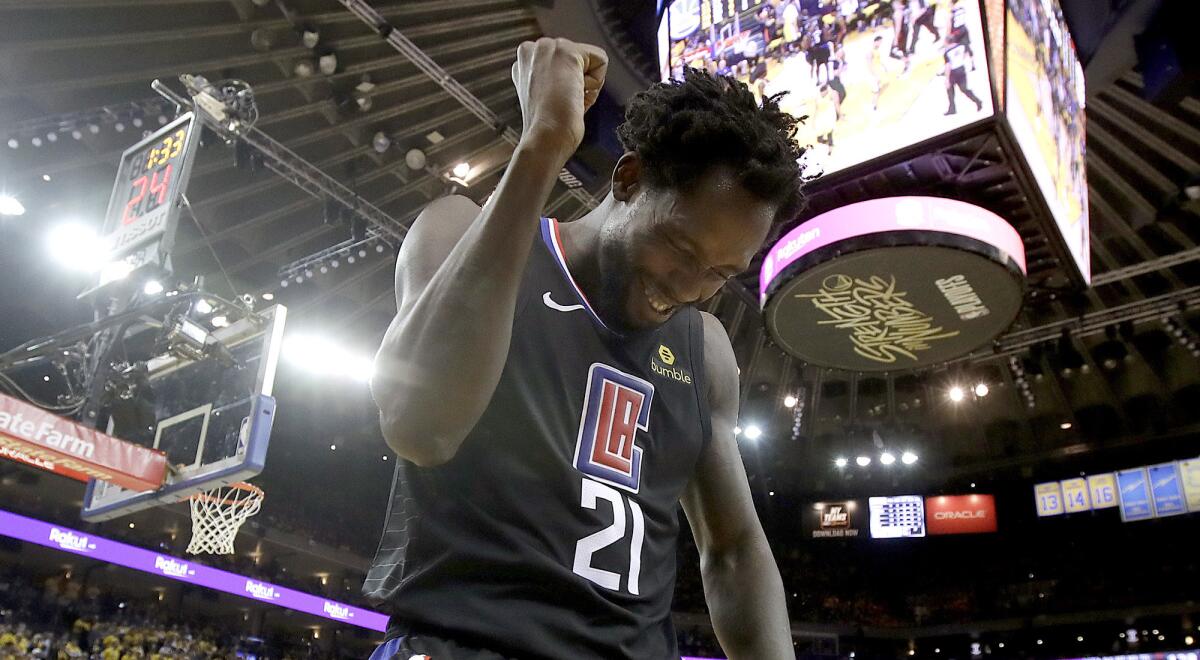 Clippers guard Patrick Beverley celebrates during the second half against the Golden State Warriors in Game 2 of their first-round NBA playoff series in Oakland on Monday.