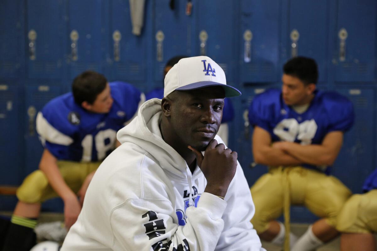 Los Angeles Romans Coach Eric Scott is pictured in the locker room before a practice on Dec. 3. Scott, a former UCLA assistant, took over a 1-9 team and now the Romans are playing for the City Division III championship.