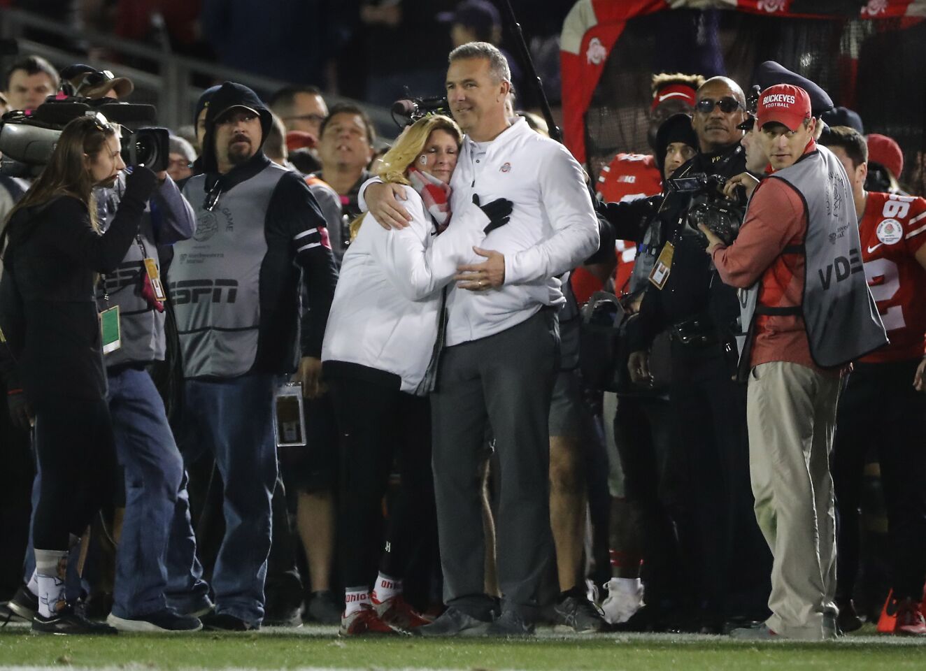 Ohio State coach Urban Meyer hugs his wife Shelley after the Buckeyes beat Washington 28-23 at the Rose Bowl on Jan. 1.