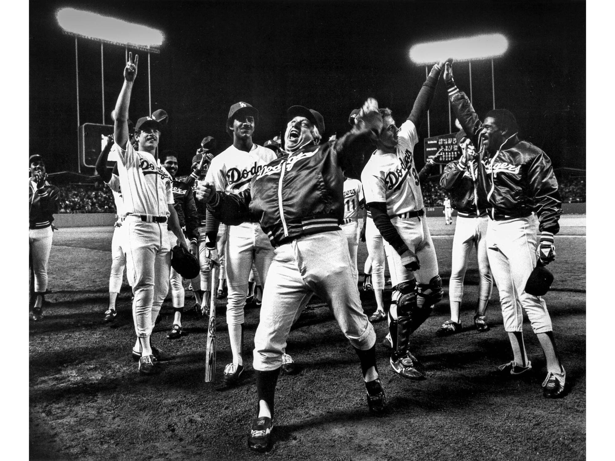 Manager Tommy Lasorda and the Dodgers celebrate winning the National League West title on Sept. 30, 1983.