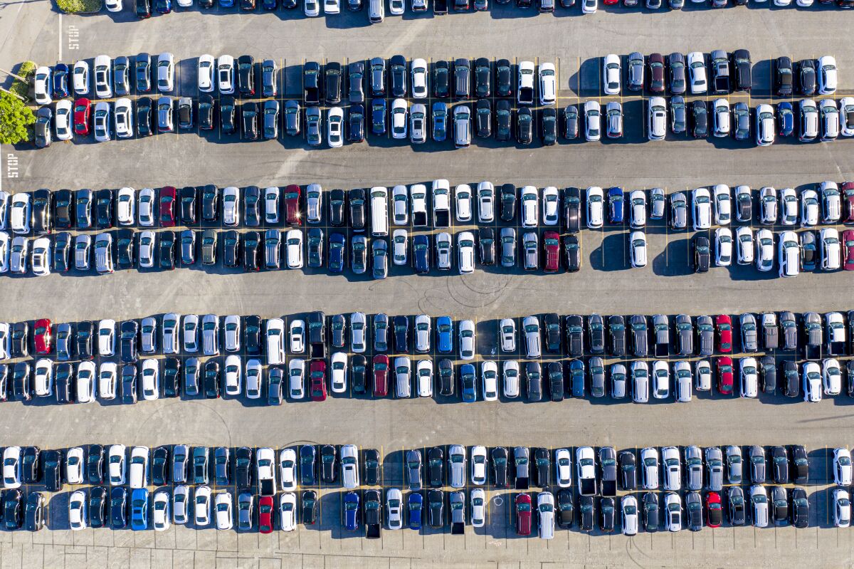 An aerial view of various parked cars.