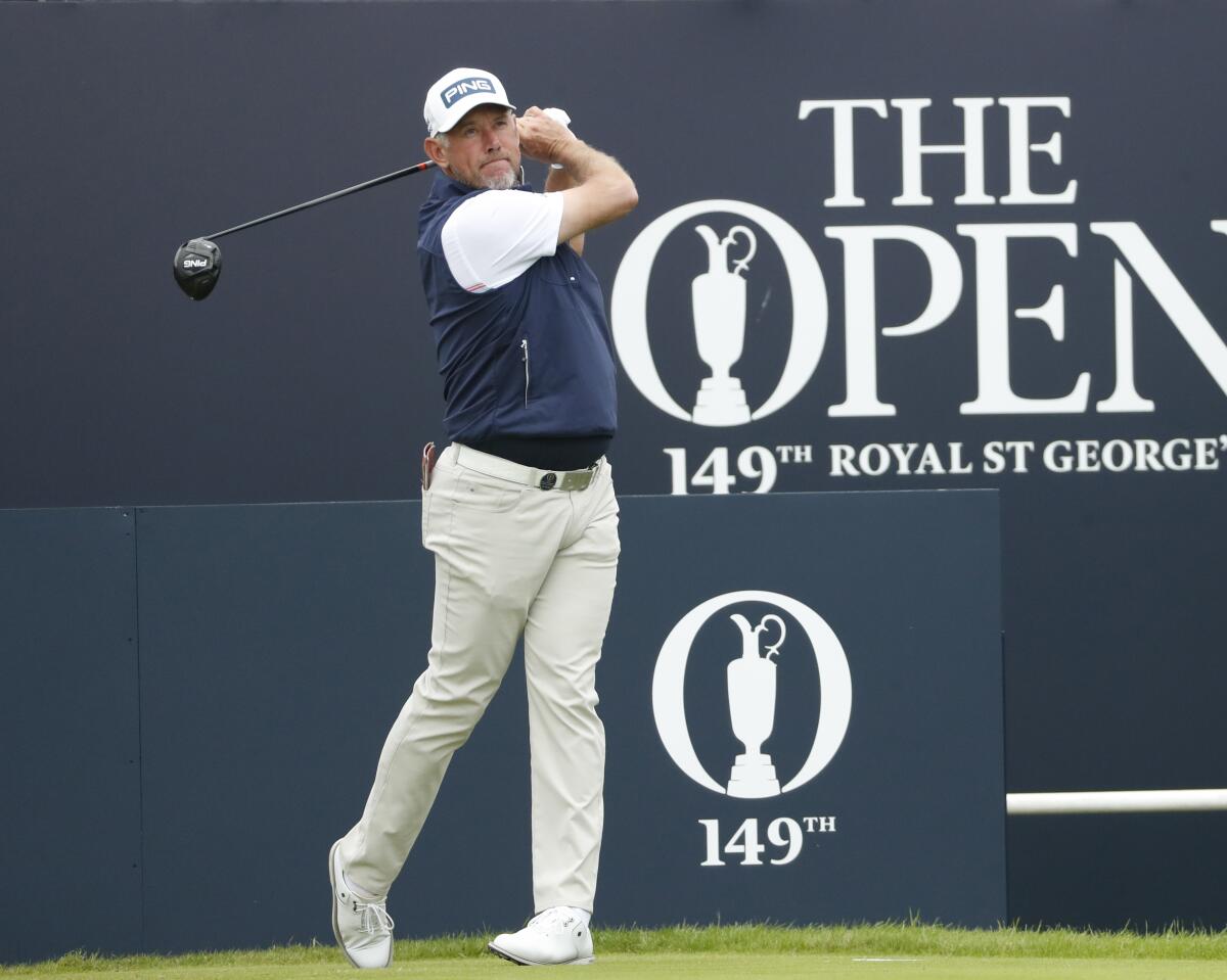 England's Lee Westwood plays his tee shot from the 1st tee during a practice round for the British Open Golf Championship at Royal St George's golf course Sandwich, England, Wednesday, July 14, 2021. The Open starts Thursday, July, 15. (AP Photo/Peter Morrison)