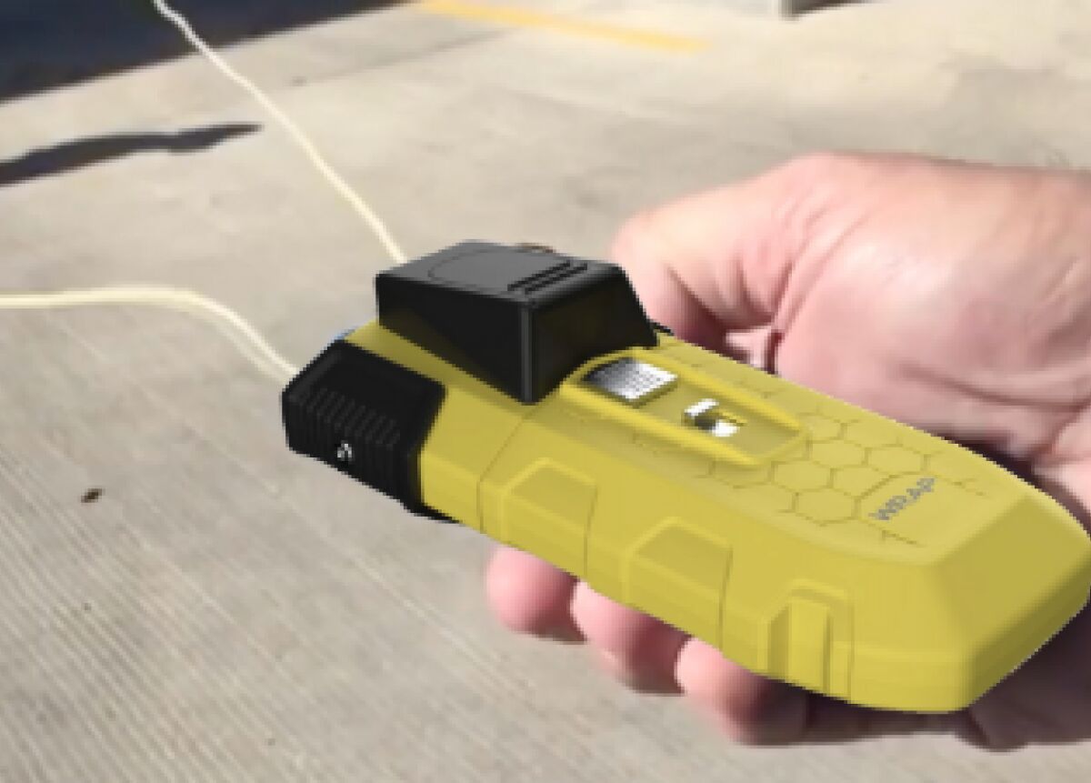 The BolaWrap devices are about the size of a larger cellphone and shoot Kevlar cords around a person's legs or arms. The LAPD will start testing the devices in January.