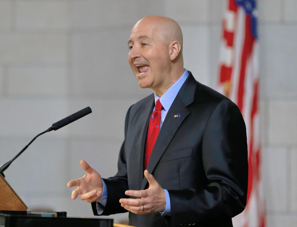 Nebraska Gov. Pete Ricketts addresses the Legislature in Lincoln, Neb., as the legislature moved to abolish the death penalty.