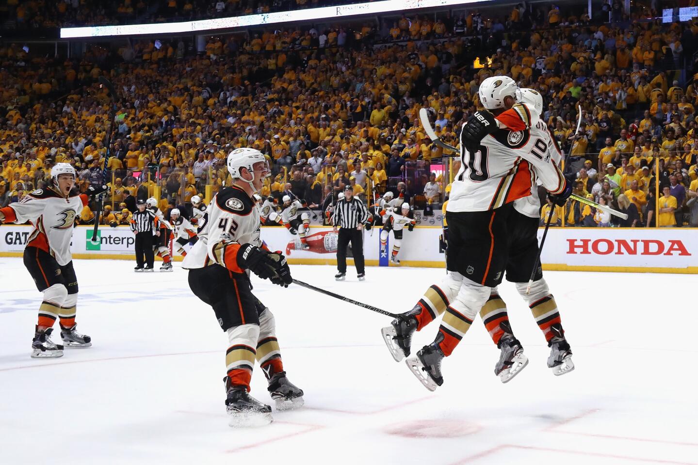 Ducks right wing Corey Perry (10) celebrates with teammates after scoring the game-winning goal against the Predators in overtime of Game 4.