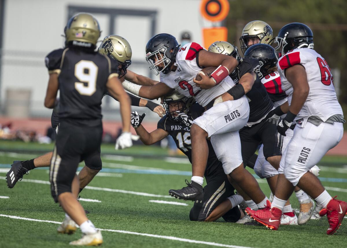 Banning's Seth Fao runs with the ball against Peninsula.