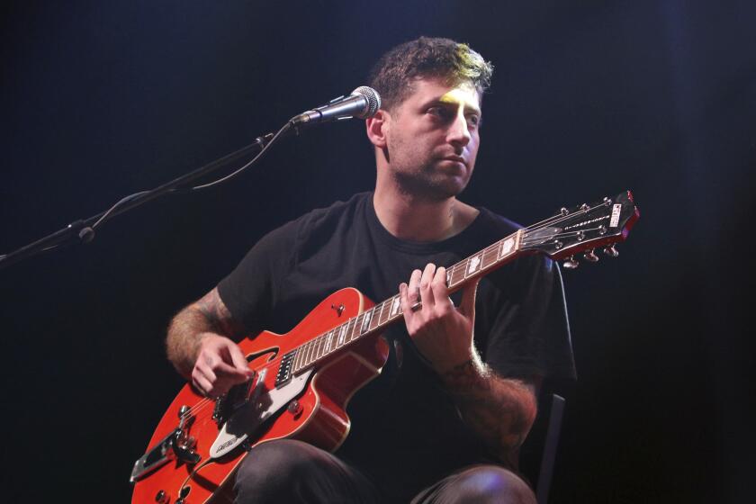 Joe Trohman with Fall Out Boy performs