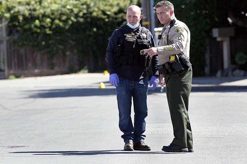 Santa Cruz County sheriff's deputies investigate the scene of a kidnapping in the Pleasure Point community early Tuesday.
