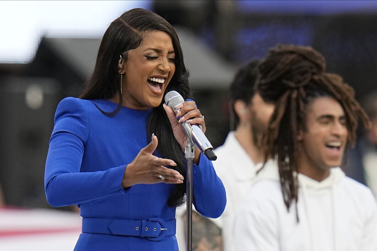 Country music artist Mickey Guyton sings the national anthem before the Super Bowl.