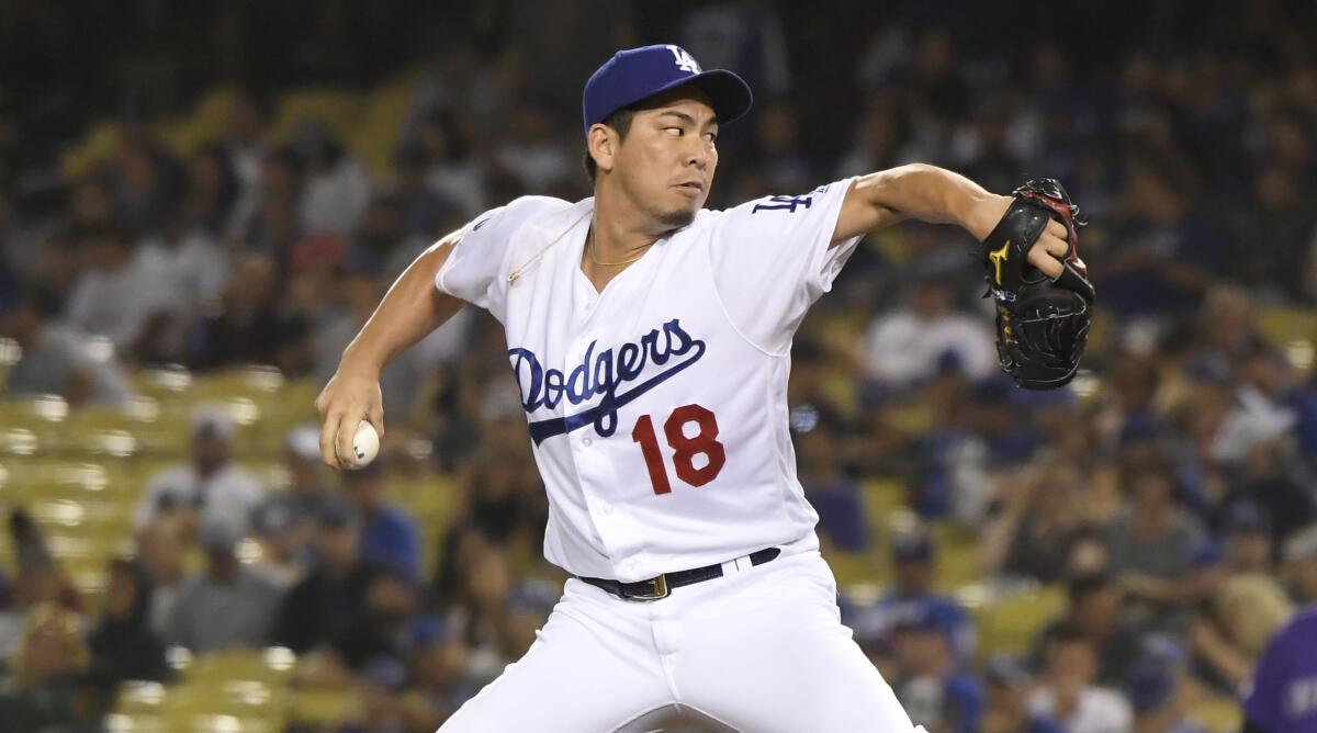 Dodgers reliever Kenta Maeda delivers against the Rockies.