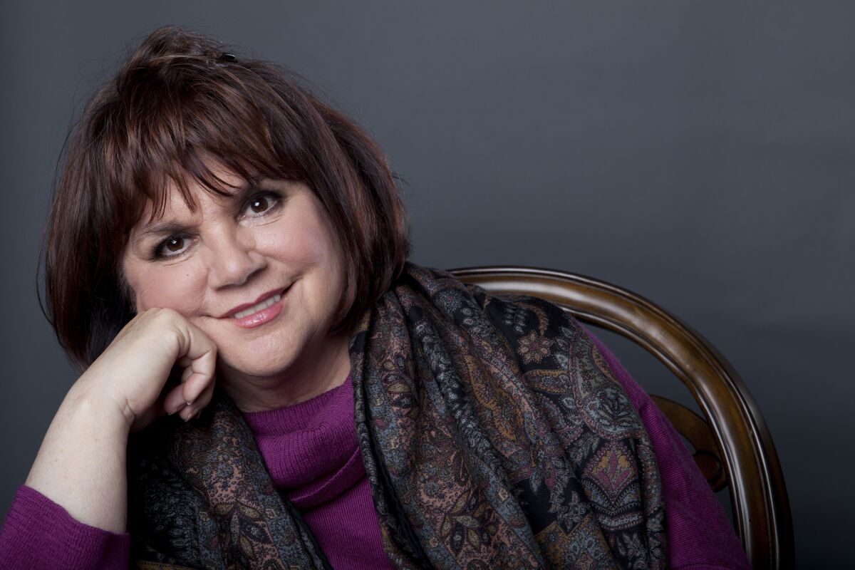 FILE - In this Sept. 17, 2013 file photo, American musician Linda Ronstadt poses in New York to promote the release of her memoir "Simple Dreams." Now at 74, the 10-time Grammy winner and Rock and Roll Hall of Famer has been recognized as a “Legend” at the 33rd annual Hispanic Heritage Awards. (Photo by Amy Sussman/Invision/AP, File)