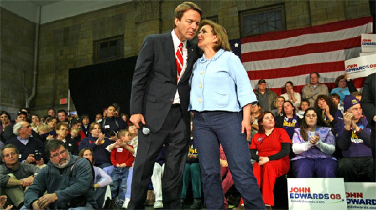 Democratic presidential candidate and former Sen. John Edwards of North Carolina takes a moment with his wife, Elizabeth, during a healthcare forum held at the Franco-American Centre in Manchester, N.H.