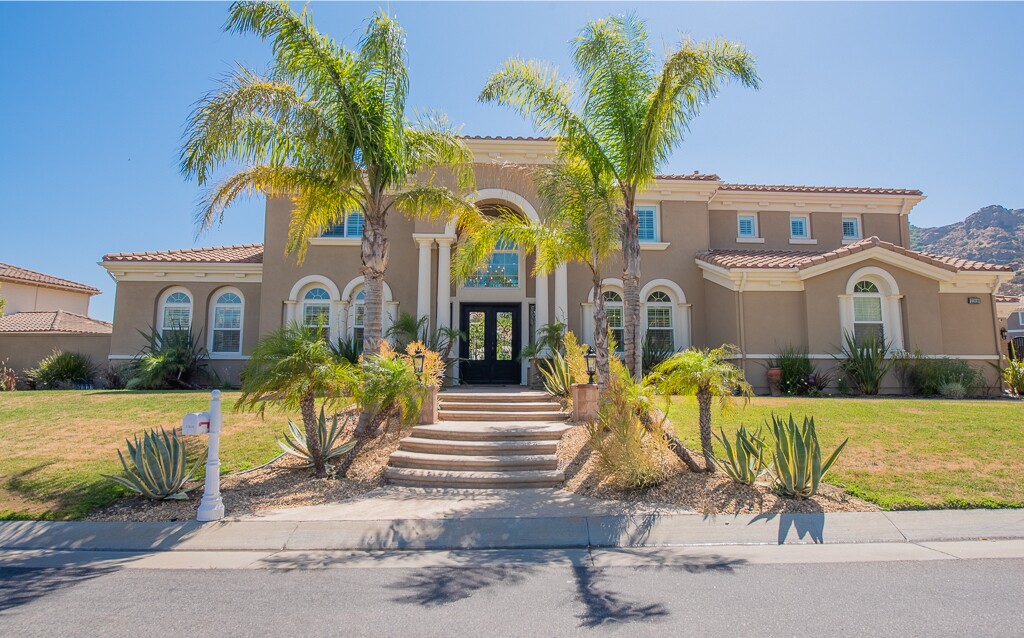 Built in 2005, the two-story home sits on a scenic acre with a swimming pool, spa and basketball court.