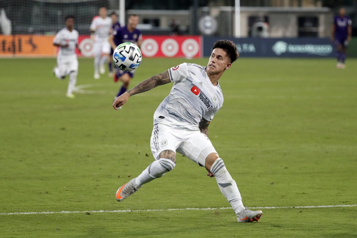 LAFC's Brian Rodriguez moves to control the ball against Orlando City.